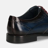 A blue Men's bugatti Derby featuring a round toe wing tip, stacked heel. Made from premium genuine leather with a durable leather outsole, this laces design offers both style and comfort.