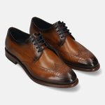 Men's Bugatti derby cognac leather shoes with a round toe and wing tip featuring a stacked heel , a leather outsole , and laces fastening.