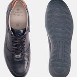 Dark blue leather sneakers by Bugatti with perforated toe detail and patterned laces.