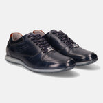 Dark blue leather sneakers by bugatti with dotted texture, matching laces, and light gray soles.