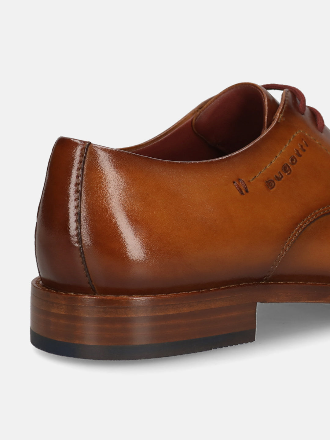 Men's Bugatti derby cognac leather shoes with a pointed toe and plain toe featuring a stacked heel , a leather outsole , and laces fastening.