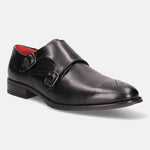 Black leather monk shoe by bugatti, featuring double buckle straps and decorative perforations at the toe.