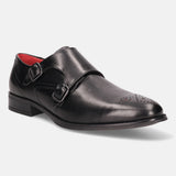 Black leather monk shoe by bugatti, featuring double buckle straps and decorative perforations at the toe.