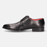 Black leather monk strap shoe by Bugatti, featuring a single strap closure and a red insole.