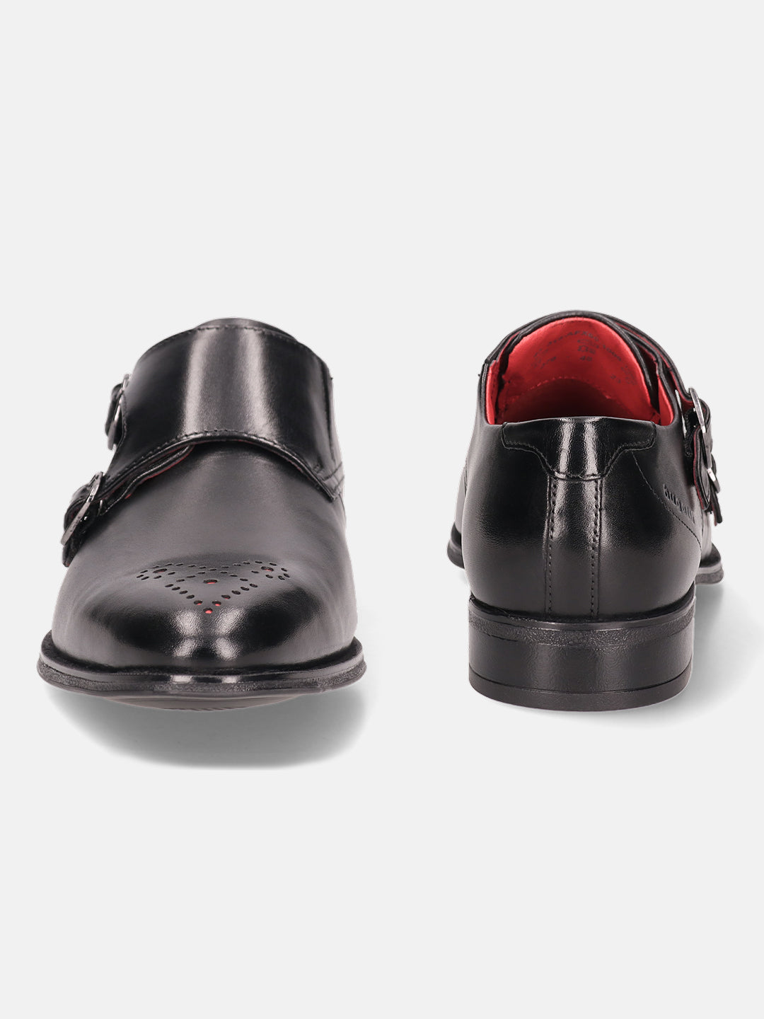 Black leather monk shoes by bugatti, with brogue detailing and a red lining.