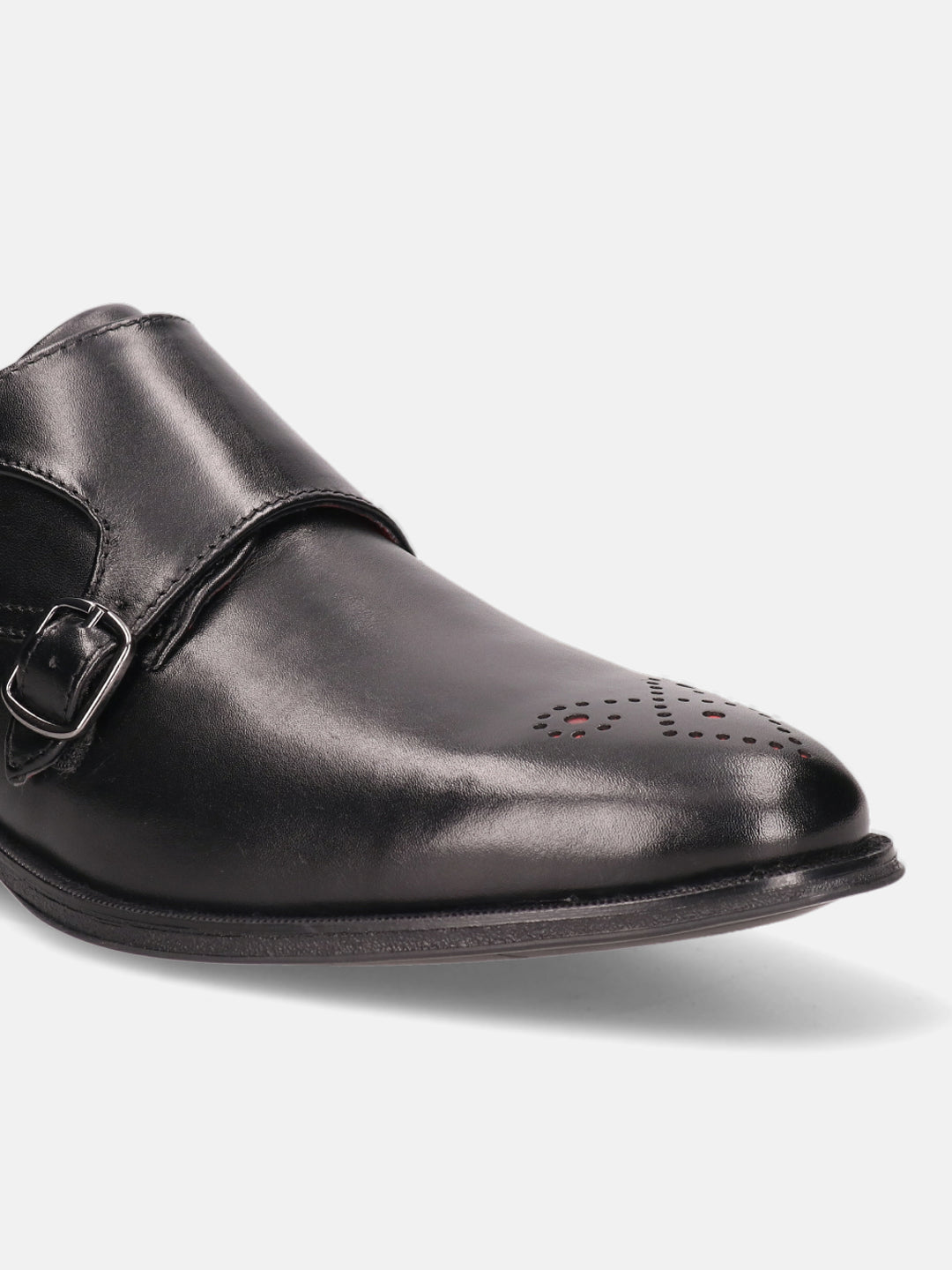 Black leather monk strap shoe by bugatti with decorative perforations at the toe.
