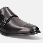 Black leather monk strap shoe by bugatti with decorative perforations at the toe.