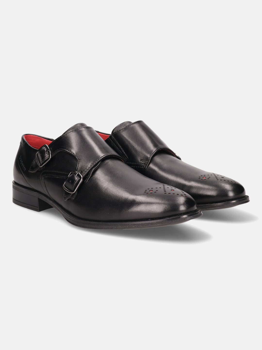 Black premium leather monk shoes by bugatti with double buckle straps and decorative perforations.