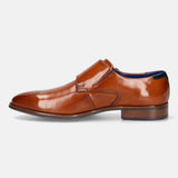 A cognac Men's bugatti Monk Shoe featuring a pointed plain toe, moulded  heel. Made from premium genuine leather with a durable tr outsole, this slip-on design offers both style and comfort.