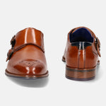 A cognac Men's bugatti Monk Shoe featuring a pointed plain toe, moulded  heel. Made from premium genuine leather with a durable tr outsole, this slip-on design offers both style and comfort.