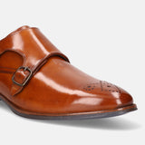 A cognac Men's bugatti Monk Shoe featuring a pointed plain toe, moulded  heel. Made from premium genuine leather with a durable tr outsole, this slip-on design offers both style and comfort.