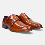 A cognac Men's bugatti Monk Shoe featuring a pointed plain toe, moulded  heel. Made from premium genuine leather with a durable tr outsole, this slip-on design offers both style and comfort.