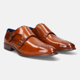 A cognac Men's bugatti Monk Shoe featuring a pointed plain toe, moulded  heel. Made from premium genuine leather with a durable tr outsole, this slip-on design offers both style and comfort.