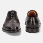 A grey Men's bugatti Oxford featuring a chisel toe plain toe, stacked heel. Made from premium genuine leather with a durable leather outsole, this laces design offers both style and comfort.