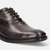 A grey Men's bugatti Oxford featuring a chisel toe plain toe, stacked heel. Made from premium genuine leather with a durable leather outsole, this laces design offers both style and comfort.