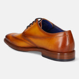 Yellow premium leather derby shoe by Bugatti, shown from a rear angle with dark laces and blue insole.