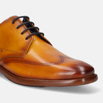 Yellow premium leather derby formal shoe by Bugatti with black laces and tonal stitching.