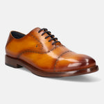 Yellow leather oxford shoes by bugatti, featuring brogue detailing and dark laces.