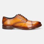 Yellow premium leather oxford shoes by bugatti, featuring brogue detailing and dark brown laces, in a side view.
