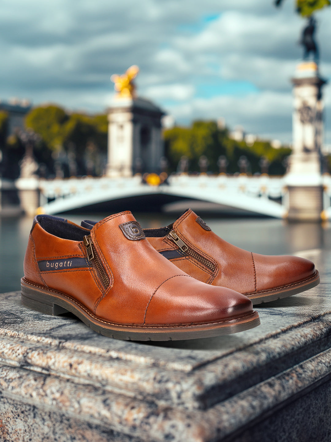 A cognac Men's bugatti Venetian Loafers featuring a round cap toe, moulded  heel, and a wide fit. Made from premium genuine leather with a durable tr outsole, this zipper design offers both style and comfort.