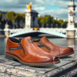 A cognac Men's bugatti Venetian Loafers featuring a round cap toe, moulded  heel, and a wide fit. Made from premium genuine leather with a durable tr outsole, this zipper design offers both style and comfort.