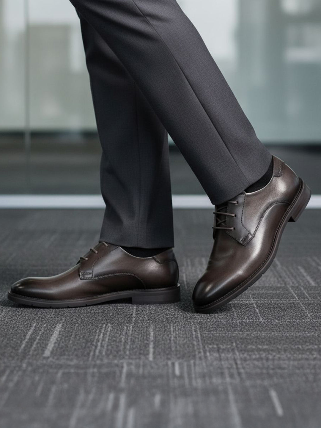 bugatti Laziano Comfort dark grey leather formal shoes worn with grey dress pants.
