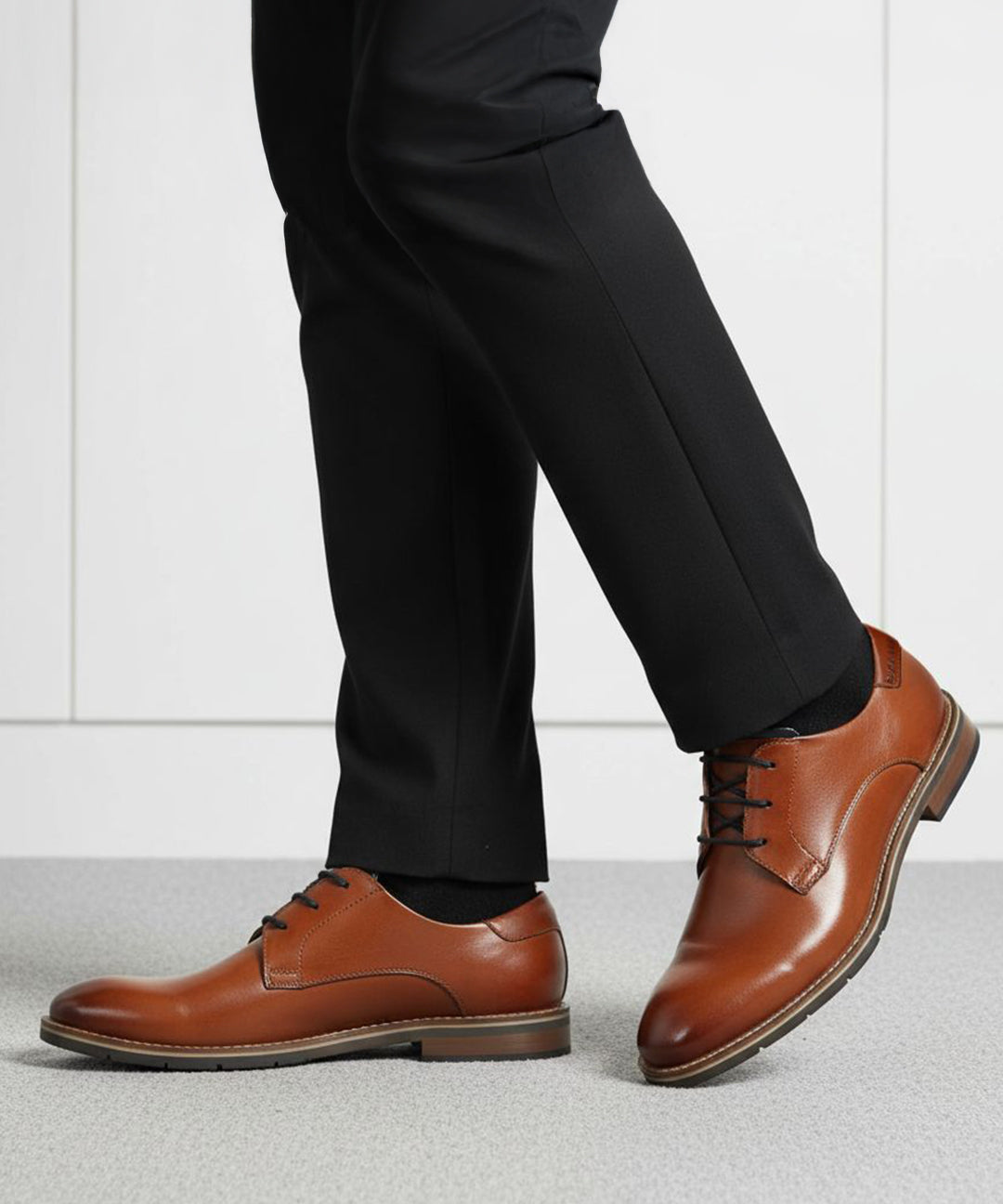 bugatti Laziano Comfort cognac leather dress shoes with black dress pants and socks.
