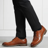 bugatti Laziano Comfort cognac leather dress shoes with black dress pants and socks.
