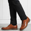 bugatti Laziano Comfort cognac leather dress shoes with black dress pants and socks.
