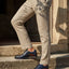 bugatti Caleo Exko dark blue leather derby shoes, accented with a brown stripe and paired with khaki trousers.
