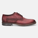 Red leather derby shoe by bugatti with triangle pattern and N 49° 11' 13.503 text detail.