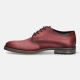 Red premium leather derby shoe by bugatti, featuring a textured geometric pattern and lace-up closure in a side view.