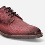 Red leather derby shoe by bugatti, featuring a subtle textured triangle pattern and dark laces.