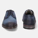 Blue leather dress shoes by bugatti with perforated pattern and dark brown sole.