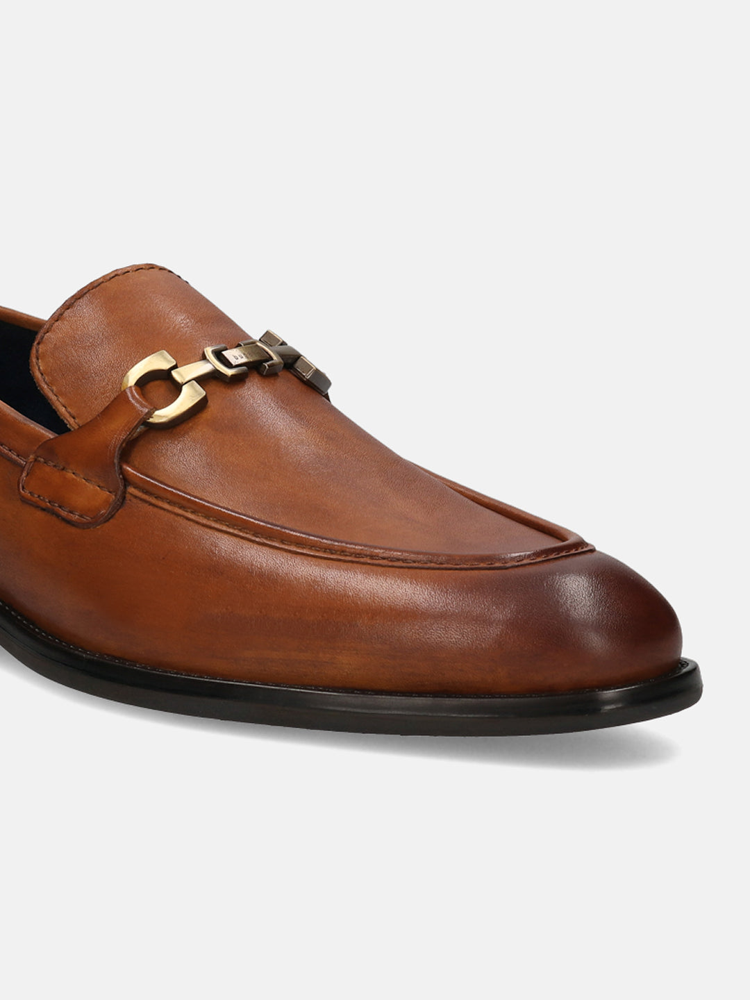 A cognac Men's bugatti Bit Loafer featuring a round apron toe, stacked heel. Made from premium genuine leather with a durable tpr outsole, this slip-on design offers both style and comfort.