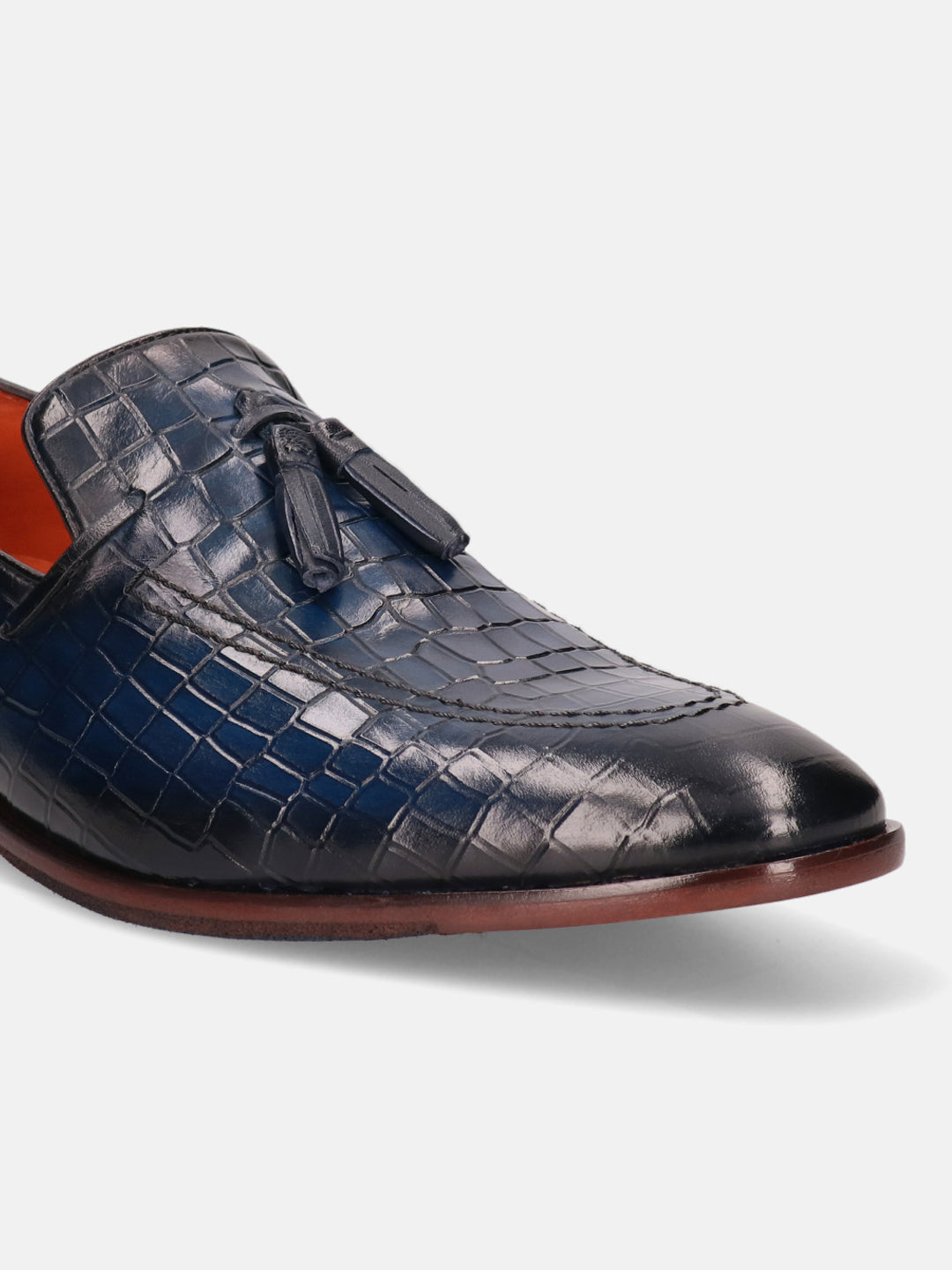 A blue Men's bugatti Tassel Loafers featuring a round toe plain toe, stacked heel. Made from premium genuine leather with a durable leather outsole, this slip-on design offers both style and comfort.