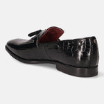 A black Men's bugatti Tassel Loafers featuring a round toe plain toe, stacked heel. Made from premium genuine leather with a durable leather outsole, this slip-on design offers both style and comfort.