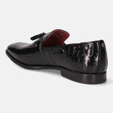 A black Men's bugatti Tassel Loafers featuring a round toe plain toe, stacked heel. Made from premium genuine leather with a durable leather outsole, this slip-on design offers both style and comfort.
