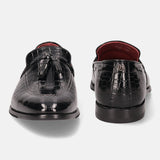 A black Men's bugatti Tassel Loafers featuring a round toe plain toe, stacked heel. Made from premium genuine leather with a durable leather outsole, this slip-on design offers both style and comfort.