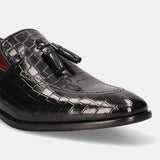 A black Men's bugatti Tassel Loafers featuring a round toe plain toe, stacked heel. Made from premium genuine leather with a durable leather outsole, this slip-on design offers both style and comfort.