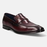 A grey Men's bugatti Penny Loafer featuring a round toe apron toe, stacked heel. Made from premium genuine leather with a durable leather outsole, this slip-on design offers both style and comfort.