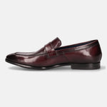 A grey Men's bugatti Penny Loafer featuring a round toe apron toe, stacked heel. Made from premium genuine leather with a durable leather outsole, this slip-on design offers both style and comfort.