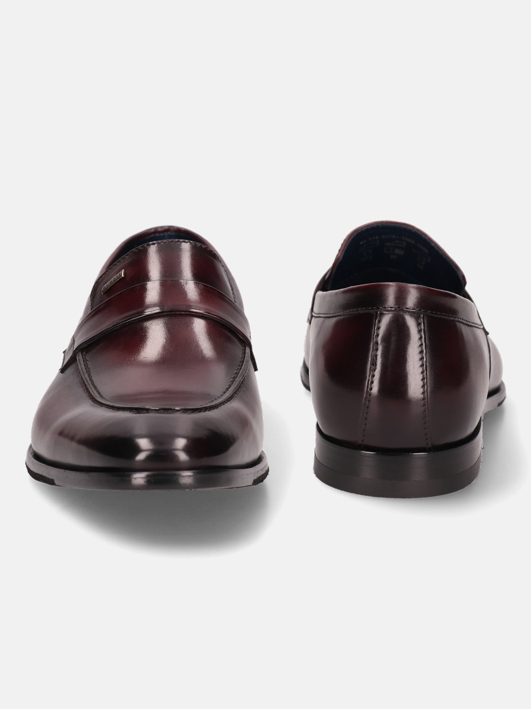 A grey Men's bugatti Penny Loafer featuring a round toe apron toe, stacked heel. Made from premium genuine leather with a durable leather outsole, this slip-on design offers both style and comfort.