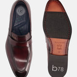 A grey Men's bugatti Penny Loafer featuring a round toe apron toe, stacked heel. Made from premium genuine leather with a durable leather outsole, this slip-on design offers both style and comfort.