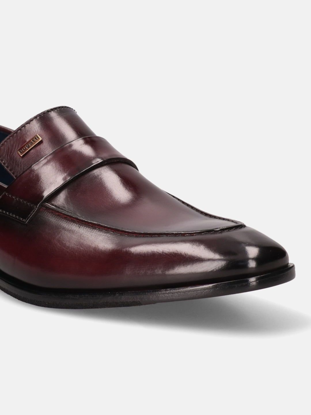 A grey Men's bugatti Penny Loafer featuring a round toe apron toe, stacked heel. Made from premium genuine leather with a durable leather outsole, this slip-on design offers both style and comfort.