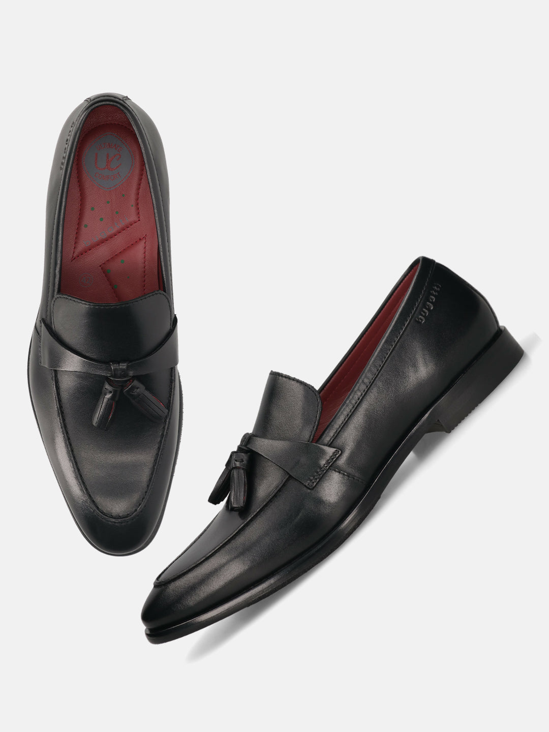 Black leather bugatti loafers with tassel detail, and a red inner lining.