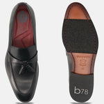 bugatti Rico black leather slip-on shoe, with decorative tassels, seen from above and sole.