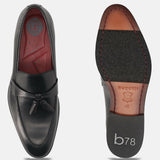 bugatti Rico black leather slip-on shoe, with decorative tassels, seen from above and sole.