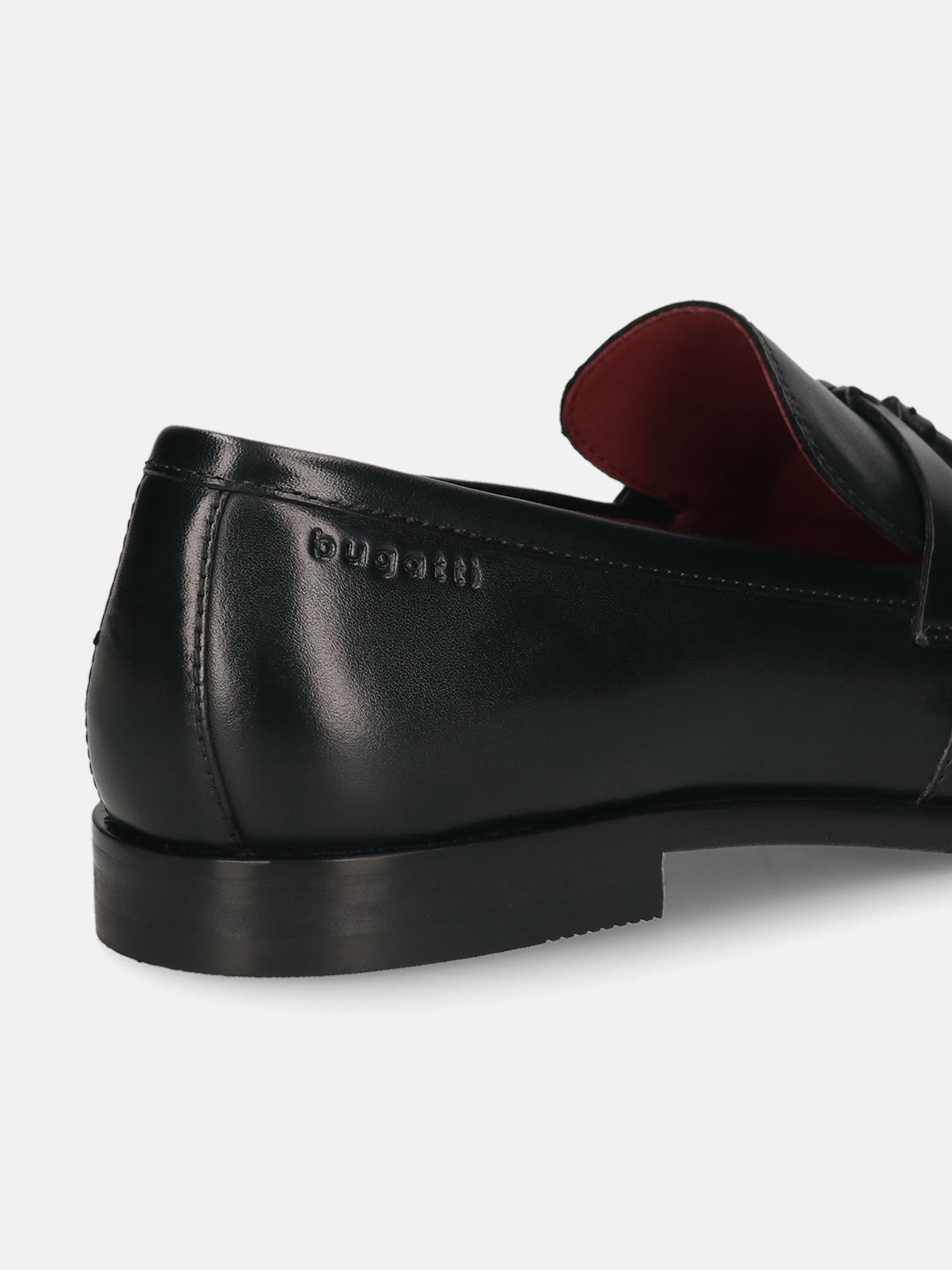 Cropped back view of a black leather slip-on loafer shoe by bugatti, featuring a red interior.
