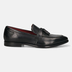 Side view of a black leather bugatti Rico slip-on loafer with a tassel.
